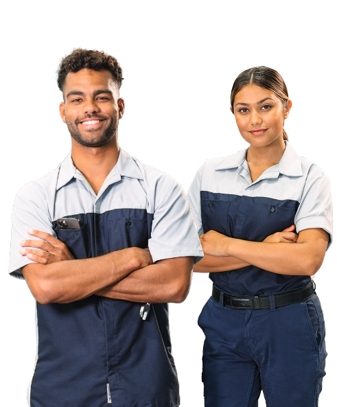Two Hyundai technicians standing with arms crossed, smiling confidently.
